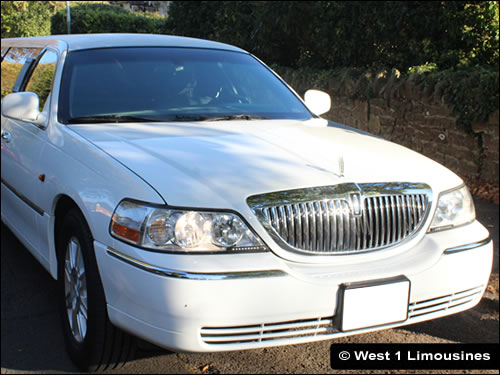 White Lincoln Town Car with eight seats